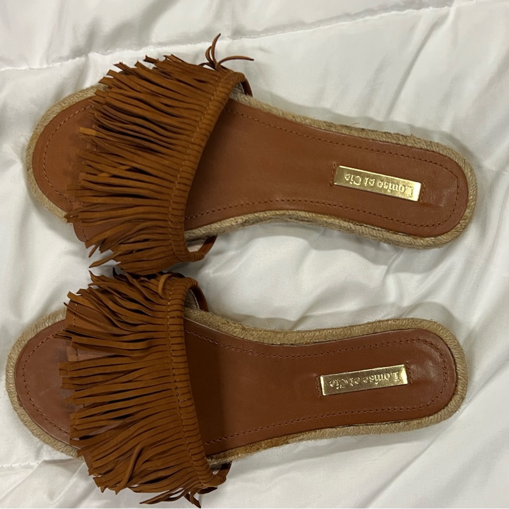 Louise et Cie women’s slide sandals.
Tan Fringe Espadrille Slides